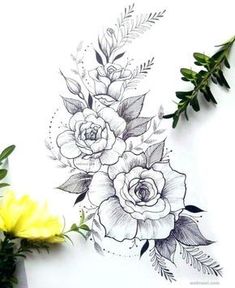 some flowers and leaves on a white paper with yellow flowers in the corner next to it