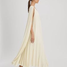 The Loreli Midi Dress Is A Softly Pleated Design With A Voluminous Skirt And Long, Cape-Style Sleeves. It Fastens With A Tie Behind The Neck And Features Large Cut-Outs To The Reverse. Pleated Self-Tie Halter Neckline Cape-Style Sleeves Cut-Out To Reverse Midi Length Regular Side Neck To Hem 52.5" / 133cm. Elegant Flowy A-line Pleated Dress, White Pleated Silk Dress, Pleated Maxi Length Dress For Brunch, White Silk Pleated Dress, Elegant Summer Dress With Cape Sleeves, Chic White Pleated Cocktail Dress, Elegant Summer Dresses With Cape Sleeves, Chic Pleated Cream Dress, Chic White Maxi Dress With Pleated Back