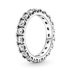 Make a classic statement with the Sparkling Row Eternity Ring. Hand-finished in sterling silver, this eternity ring features a band inlaid with sparkling clear man-made cubic zirconia. The design looks equally beautiful worn solo or stacked with other rings. Style it with bands in similar tones to create a monochromatic look, or go for contrasting metals for a combination that pops. This ring is designed to be a wardrobe essential for years to come. Classic Promise Ring With Sparkling Stones, Classic Diamond Promise Ring With Sparkling Stones, Classic Rings With Sparkling Round Cut Stones, Classic Cubic Zirconia Rings With Sparkling Stones, Classic Diamond Ring With Sparkling Stones, Classic Round Diamond Ring With Sparkling Stones, Zircon Ring, Birthday Jewelry Gift, Ring Fit