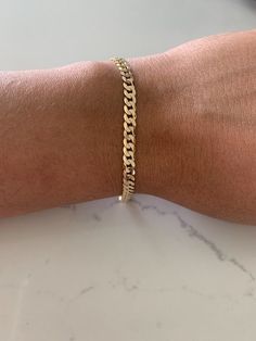 This 14K Yellow Gold Cuban Link Bracelet boasts an impressive 4.8MM width and 8" length. Crafted from 14K gold and featuring a lobster clasp, this luxurious piece is ideal for both men and women. Show off your style with this solid and real gold bracelet. ------------------------------------------- ------------------------------------------------- Great bracelet for everyday wear. It is 14K solid Gold. The 14K Gold Bracelet makes a great gift for any loved one Birthday present. Get yours today. Male Bracelets Gold For Men, Gold Bracelets For Men, Gold Cuban Link Bracelet, Silver Evil Eye Bracelet, Bracelet Or, Real Gold Bracelet, Bracelet Measurements, Mens Glasses Fashion, Cuban Link Bracelet