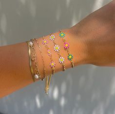 These daisy chains are the most adorable new addition to our sliding adjustable bracelets. Available in four different colors, you will love these colorful bracelets! Adjustable to any wrist size. 14k gold plated over copper Trendy Resizable Jewelry For Spring, Dainty Adjustable Jewelry For Spring, Dainty Adjustable Spring Jewelry, Adjustable Dainty Spring Jewelry, Dainty Spring Jewelry With Adjustable Chain, Spring Dainty Jewelry With Adjustable Chain, Resizable Adjustable Jewelry For Spring, Resizable Jewelry As A Spring Gift, Resizable Jewelry Gift For Spring