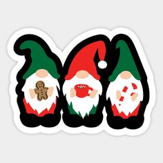 three christmas gnomes with gingerbread stickers on their backs, one in green and the other in red