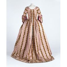 Striped silk velvet sack-back gown (back), possibly Scottish (from French textile, 1774-75), 1775-80 (altered 1870-1910). "This is a very rare example of the use of velvet in 18th-century women’s dress. In this extraordinary example, the chiné process has been combined with velvet - a difficult technique that was produced only in a few places in France. The silk for this fabric is reputed to have cost 36 shillings a yard. With an average of 17 yards required for a gown and petticoat of this styl Types Of Gowns, Pink Gown