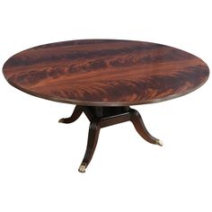 an oval dining table with two leaves on the top