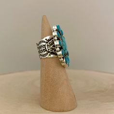 Sterling silver cluster ring set with China mountain turquoise. This ring features beautiful stones and an amazing stamping design on the shank. Handmade by Navajo silversmith, Darrell Cadman. Ring size: 6.5 Measurements: 1.5" x 1.25" Center stone: 0.63" x 0.5" Other stone: 0.31" x 0.19" Band width: 0.59" Weight: 0.76oz (21.5g) Materials: sterling silver(silver925), China mountain turquoise *About Darrell Cadman* Darrell Cadman was born 1969 in Gallup, New Mexico and began making jewelry in 1992 Western Style Stamped Turquoise Ring Gift, Unique Stamped Turquoise Ring, Artisan Stamped Turquoise Ring, Gallup New Mexico, Cluster Ring Set, Beautiful Stones, Kingman Turquoise, Stamp Design, Cluster Ring