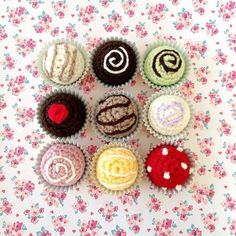 six cupcakes are arranged in rows on a table