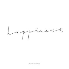 the word happiness written in cursive handwriting