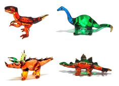 four different colored plastic dinosaurs on a white background