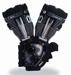 two black motorcycle engine covers sitting on top of each other in front of a white background