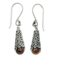 Beautifully modern these earrings reveal extravagant silver arabesques. Buana adds brown cultured pearls in a design of modern enchantment. .925 Sterling silver Brown Sterling Silver Drop Earrings, Elegant Brown Teardrop Earrings For Gift, Elegant Brown Sterling Silver Earrings, Elegant Brown Pierced Teardrop Earrings, Elegant Brown Teardrop Pierced Earrings, Brown Dangle Jewelry For Formal Occasions, Elegant Brown Drop Earrings, Formal Brown Sterling Silver Earrings, Elegant Brown Dangle Earrings