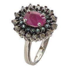 This elegant sterling silver ring size 5 is embellished with an oval Ruby and semi-precious round stones Aquamarine, along with sparkling glass diamonds. It is marked with the quality stamp "925" and can be easily adjusted . Elegant Round Diamond Ring With Stones, Elegant Round Diamond Ring, Fine Jewelry Rings With Stones For Formal Occasions, Formal Fine Jewelry Rings With Stones, Elegant Multi-stone Cluster Ring Oval Shape, Elegant Oval Multi-stone Cluster Ring, Classic Oval Multi-stone Cluster Ring, Oval Multi-stone Ruby Ring In White Gold, Classic Oval Cluster Ring With Multi-stone