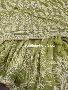 "Gorgeous green Chikankari georgette saree with hand embroidery and delicate gold \"Mukaish\" add ons and crochet lace. Heavy palla and broad border all along the body. Flowy sheer fabric! Includes an embroidered blouse piece too. Fall attached and petticoat included" Green Chikankari Embroidery Pre-draped Saree In Georgette, Unstitched Pista Green Fabric With Chikankari Embroidery, Green Chikankari Embroidered Saree For Festivals, Green Georgette Saree With Chikankari Embroidery, Green Chikankari Embroidered Organza Fabric, Georgette Sarees, Embroidered Blouse, Sheer Fabrics, Blouse Piece