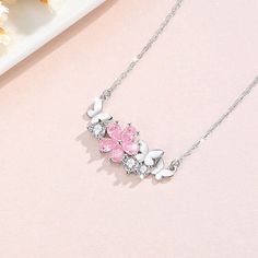 Indulge in the beauty of spring with our 925 Silver Pink Cherry Blossom Butterfly Necklace. Crafted with the finest materials, this delicate piece features a charming butterfly and blooming cherry blossom design. Elevate any outfit and add a touch of elegance to your look. Tarnish proof Water proof Sleep / Nap proof Safe for sensitive skin Wear it while working out &showering Designed to wear 24/7 If there is no stock, the product will take 60 days to produce Please leave your usual email address and phone number for order contact There is a discount code on the store homepage, limited to one time per person, welcome to use Details Materials: 925 Sterling Silver Stone: CZ Diamond Weight: 2.5G Length：40+5CM SKU：AN24071906 Cherry Blossom Butterfly, Cherry Blossom Design, Sun And Moon Rings, Kawaii Bedroom, Pink Cherry Blossom, Flat Back Earrings, Pink Cherry, Blossom Design, Feather Necklaces