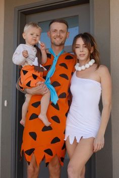 a man and woman are dressed up as the flintman and his wife pose for a photo