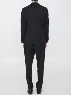 Two-piece suit in black wool. The jacket features classic lapels with brooch on lapel, single-breasted closure, two front welt pockets, a welt pocket on chest and buttoned cuffs. Straight-leg trousers with zip and button closure, two side welt pockets, two rear buttoned welt pockets and belt loops. Regular fit. The model is 184cm tall and wears size IT 50.Size nationality: IT Product number: 6734827 Product code: EQ7754SK62403999 Composition: 100% WOOL Suit With Jacket, Wool Suit, Straight Leg Trousers, Dress With Cardigan, Premium Brands, Clothes Collection, Cardigan Jacket, Black Wool, Luxury Retail