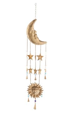 a sun and moon mobile hanging from a chain