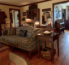 a living room filled with furniture and wooden floors