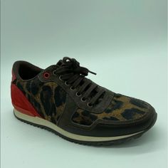 Beautiful And Authentic Ch Animal Print With Red Back Sneaker In Very Good Conditions, Few Times Used Very Trendy, Fast Shipping Service Red Casual Custom Sneakers With Studded Outsoles, Designer Lace-up Sneakers With Speckled Midsole, Red High-top Sneakers For Walking, Brown Slip-on Sneakers With Red Sole, Red Lace-up Walking Sneakers, Brown High-top Custom Sneakers With Red Sole, Red Sneakers With Round Toe For Walking, Sporty Brown Custom Sneakers With Red Sole, Sporty Red Sneakers For Walking