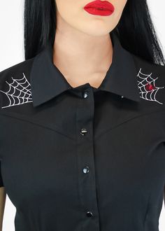 To all Rockabilly fans and those in love with the spooky genre, this lavish top is now available for you to style! The cute collar, short sleeves, and snaps make the blouse oh so girly and stylish.  Dress up with high waist pants or fitted jeans, circle skirts, and rockabilly pumps or flats. - Machine Washable - 100% Cotton - Made in USA Measurements are in inches SizesBust....Waist....Length X-Small322826 Small343026 Medium....363227 Large383428 X-Large403629 2XL423829 3XL444030 Gothic Fitted Short Sleeve Top, Fitted Gothic Short Sleeve Tops, Punk Style Short Sleeve Halloween Tops, Edgy Short Sleeve Halloween Tops, Punk Style Short Sleeve Party Top, Punk Style Party Top With Short Sleeves, Punk Style Short Sleeve Top For Party, Rocker Fitted Tops For Halloween, Rocker Style Fitted Tops For Halloween