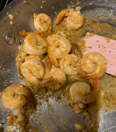 some shrimp and other food items in a pan