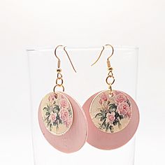 These pink paper earrings for women are lightweight and durable. They are coated to make them moisture-resistant and shiny. They consist of 2 circles. The larger one is 1.5 inches and the smaller one-inch one has pink roses on it. The price of these one of a kind earrings is $13.50 but the shipping is free if you purchase $35.These earrings would make a great gift for a friend or a gift for any woman. Thanks for stopping by SusanWillifordDesign. Pink Circle Earrings For Gift, Pink Circle Earrings For Gifts, Pink Circle Earrings As A Gift, Handmade Pink Circle Earrings, Handmade Pink Circular Earrings, Paper Earrings, Pink Paper, One Inch, Houston Tx