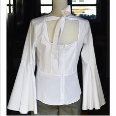 Ties Across Back At The Top. Not Quite A Boat Neck But Close. Has Some Stretch. Elegant Cotton Shirt For Brunch, Elegant Fitted Shirt For Brunch, Fitted White Shirt For Brunch, Bell Sleeve Blouse, Nanette Lepore, Bell Sleeve, Boat Neck, Bell Sleeves, Sleeve Blouse