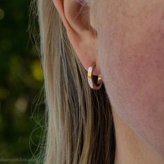 These small gold hoop earrings are handmade by me in the beautiful Pacific Northwest of North America. They are made of solid 14k yellow gold They also have locking 14k gold backs and posts. Size: 16mm exterior diameter, 13mm interior diameter. 2mm wide and 1.5mm thick. I strive to run an ecologically sustainable business. Because my jewelry is made using hand fabrication processes, it has lightness, durability and detail unachievable via mass production. Read more about me here: https://www.ets Minimalist Gold Jewelry With Matte Finish, Minimalist Matte Gold Jewelry, Minimalist Matte Finish Gold Jewelry, Gold Matte Finish Jewelry Gift, Matte Finish Gold Jewelry Gift, Minimalist Matte Finish Jewelry Gift, Small Silver Hoop Earrings, Small Gold Hoop Earrings, Port Townsend