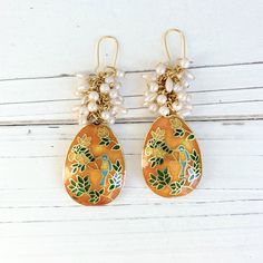 "Dangle statement earrings with absolutely divine cloisonne teardrop beads with bluebird and green leaves design suspended from a vintage stock pearl cluster. The gold and luster of the cloisonne give these dangle earrings a rich look. 3\" drop with gold-plated, nickel-free ear wires. Handmade in the USA.  Thanks for looking!" Gold Hand-painted Teardrop Earrings, Gold Teardrop Earrings Hand Painted, Gold Hand Painted Teardrop Earrings, Bohemian Gold Enamel Earrings, Elegant Hand Painted Teardrop Earrings, Meenakari Dangle Pearl Earrings, Pearl Cluster Earrings, Halloween Necklace, Muslin Bags