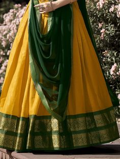 Introducing our stunning great yellow zari weaving kanchipuram silk function wear lehenga choli! This exquisite ensemble features a yellow color Kanchipuram silk lehenga with intricate zari weaving work, paired with a matching green color Kanchipuram silk choli also adorned with zari weaving work. Completing the look is a green color georgette plain dupatta with intricate lace borderwork.
The lehenga is beautifully stitched up to 42 inches in length, with a 3.70-meter flair, while the choli come Green Slub Silk Lehenga For Navratri, Unstitched Yellow Slub Silk Sharara, Yellow Slub Silk Bollywood Set, Yellow Slub Silk Anarkali Set With Dupatta, Diwali Yellow Slub Silk Sharara, Yellow Slub Silk Anarkali Set With Pallu, Yellow Cotton Silk Anarkali Set With Cutdana, Gold Cotton Silk Anarkali Set With Traditional Drape, Traditional Yellow Slub Silk Anarkali Set