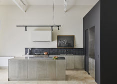 the kitchen is clean and ready to be used as a dining room or office space