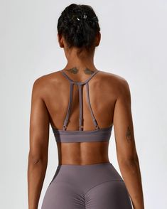 Made from our signature naked fabric Moderate support sports bra High neckline Adjustable shoulder straps Racer back silhouette Open back design 4 way stretch Sweat wicking and breathable Model: Bust 88cm, Waist 60cm, Hip 102cm, Height 174cm, Weight 55kg, Wears size S Our High Neck Open Back Sports Bra is a slinky design that moves with your body and allows for ultimate second skin comfort. Cut to a standard sports bra length, it is a racer back design with multiple adjustable straps. Strappy Sports Bra With Built-in Bra, T-back Sports Bra With Straps For Workout, Strappy Back Sports Bra For Yoga, Sports Bra With Strappy Back And Built-in Bra, Sportswear Strappy Back Sports Bra For Yoga, Racerback Sports Bra For Pilates, Adjustable Straps T-back Sports Bra For Yoga, Sporty Racerback Sports Bra With Straps, Compressive Sports Bra With Adjustable Straps