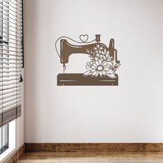 a wall decal with a sewing machine and flowers