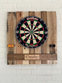 a dart board mounted to the side of a wall