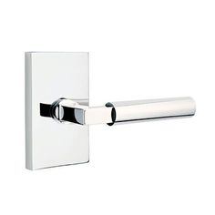 a white toilet roll holder with chrome finish and black trim on the front of it