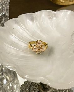 The Clover Ring will bring you luck, original French suit for centuries: clubs. Perfect for a casino look for the clubs card symbol. This ring is made with half pearl shell and cubic zirconia. 18kt gold plated silver. Gold Pearl Rings For Party, Party Gold Rings With Pearl, Elegant Gold Pearl Ring For Party, Party Gold Pearl Rings, Formal Open Pearl Ring, Luxury Pearl Ring For Gift, Luxury Pearl Diamond Ring As Gift, Elegant Pearl Ring For Party, Formal Rose Gold Pearl Ring