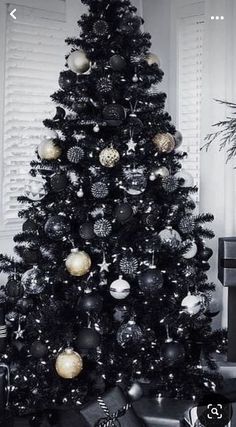 a black and white christmas tree with ornaments