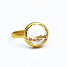 This beautiful stackable bezel set ring features round faceted natural Clear Quartz gemstone in 18K Vermeil Gold. The ring has a 925 stamp. Gemstone size is 12 mm. Since I use natural gemstones, the stones may vary slightly in color and shape.This ring is available in two finishes:✦ 18K VERMEIL GOLD✦ BRIGHT STERLING SILVER Please specify your size and metal finish at the checkout.Ring will be shipped in Danique Jewelry branded box.Please contact me for any additional info. Thanks! Faceted Gold Moonstone Ring, Gold Faceted Moonstone Ring, Gold Rings With Smooth Bezel And Round Stone, Classic Faceted Round Cut Ring, Faceted Round Crystal Ring For Anniversary, Round Faceted Crystal Ring For Anniversary, Faceted Crystal Ring For Formal Occasions, Gold Crystal Ring With Bezel Setting, Classic Round Faceted Topaz Ring