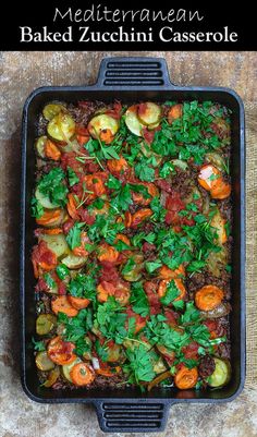 a casserole dish with meat and vegetables in it