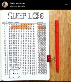 a notebook with a sleep log on it next to a red pen