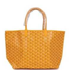 This St. Louis PM tote is of yellow Goyardine canvas with palladium hardware, contrast stitching, and has a matching detachable button closure wallet The interior is lined with white canvas.Origin: FranceCondition: New and never worn Accompanied by: Dustbag and felt Measurements: 13.3" x 11" x 6"; 7" shoulder strap Lv Neverfull Mm, Neverfull Mm Monogram, Louis Vuitton Damier Azur, Louis Vuitton Damier Ebene, Yellow Leather, Vintage Louis Vuitton, Hermes Bags, Leather Silver, Chain Shoulder Bag