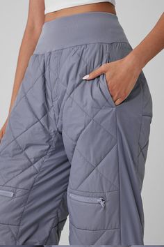 Lightly filled with a quilted finish, the Snowriders are a sleeker take on the puffer pants trend. They have a wide ribbed waistband, plenty of pockets (6 with zippers, 2 side-slit style), and bungee hems that transform the fit from wide-leg to jogger-style. You’ll feel like you’re wearing a cozy duvet, but you’ll look seriously snow-girl chic—just don’t forget the matching Snowrider top and jacket. Puffer Pants, Pants Trend, Athleisure Pants, Snow Girl, Pant Trends, Fitness Inspiration Body, Womens Capris, Window Shopping, Sports Wear