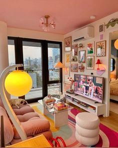 a living room filled with furniture and a flat screen tv