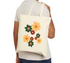 tote bag, reusable shopping bag, everyday bag, birthday gift, artsy bag, mother's day gift, floral pattern bag, artsy bag, washable bag This 100% cotton bag comes in one size - 15" x 16"- perfect for everyday wear. While the canvas material will show off your designs in great colors, it's durable and will last for years. The bag features 20" handles (made from the same canvas), making it easy to carry even with a week's worth of shopping. .: 100% cotton canvas .: Heavy fabric (12 oz/yd² (406.9 g/m .: Sewn-in label .: Available in natural and black colors Everyday White Floral Print Canvas Bag, Eco-friendly Tote Canvas Bag For Mother's Day, Large Eco-friendly Canvas Bag For Gifts, Artsy Cotton Canvas Bag For Everyday, Artsy Cotton Canvas Bag For Gift, Large Eco-friendly Canvas Bag As Gift, Artsy Cotton Canvas Bag As Gift, Artsy Cotton Canvas Bag Gift, Spring Cotton Bags Perfect As Gifts