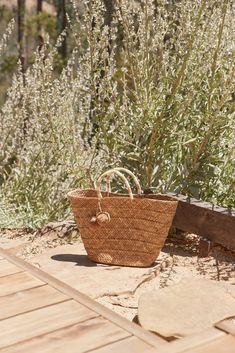 Introducing the Oversized St Tropez. Our best-selling tote now comes in an oversized version that is equally at home in the city as on the coast. Toss in your beach towel and sunscreen for weekend getaways, then use it to carry all your daily essentials once you're back home. Handcrafted from all-natural dried woven seagrass straw using a time-honored Filipino basketweaving technique. Features yarn-wrapped handles with coordinating raffia pompoms. Measures 22" W by 13" H by 6" deep with a 4.75" Summer Beach Bag With Rolled Handles, Spring Vacation Beach Bag With Rolled Handles, Vacation Beach Tote Bag With Rolled Handles, Summer Beach Bags With Rolled Handles, Natural Color Beach Bag With Rolled Handles For Vacation, Summer Beach Bag With Rolled Handles For Travel, Natural Beach Bag With Rolled Handles For Vacation, Beach Bags With Rolled Handles, Summer Travel Beach Bag With Rolled Handles