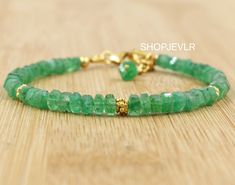 AAA QUALITY EMERALD RAW FACETED BEADED BRACELAT, BEST QUALITY. HANDMADE JEWELRY. Stone- Emerald Material- 925 Sterling Silver Finish- 18k gold filled Beads size- 3.45 to 4.36 MM External length- 1 inch If you are not sure about what size of bracelet you want to buy then Here is the size chart of the bracelet. Note :- The data given in the chart is not accurate. For Better results, measure your wrist size using tape/thread/scale. For Kids - 5 or 5.5 inches Adult Small - 6 or 6.5 inches Adult Med. May Birthstone Jewelry With Faceted Beads As A Gift, Faceted Beads Bracelets As May Birthstone Gift, Faceted Beads Bracelet For May Birthstone Gift, May Birthstone Bracelets With Faceted Beads As Gift, Faceted Rondelle Bracelets As Gift, Faceted Rondelle Bracelet As Gift, Rondelle Faceted Bracelet As Gift, Hand-strung Bracelets As May Birthstone Gifts, Hand-strung May Birthstone Bracelets For Gifts