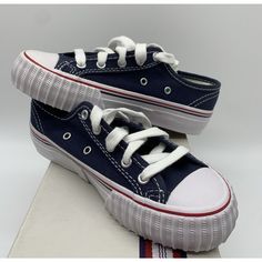 Elevate Your Kid's Style With These Archival Reissue Pf Flyers Navy Sneakers. These Sneakers Are Perfect For Casual Wear And Come In A Unisex Design. The Lace-Up Closure Ensures A Secure Fit While The Blue Color Adds A Pop Of Color To Any Outfit. These Sneakers Are Crafted With High-Quality Materials And Are Brand New In The Box. The Pf Flyers Logo On The Side Adds A Touch Of Authenticity To The Shoes. These Shoes Are Available In Us Size 13 And Uk Size 12.5, And Eu Size 31. Don't Miss Out On Th Blue Canvas Sports Shoes With Round Toe, Blue Sports Canvas Shoes, Blue Cotton Canvas Shoes With Vulcanized Sole, Casual Navy Non-slip Sneakers, Blue Cotton Canvas Shoes With Rubber Sole, Blue Low-top Cotton Canvas Shoes, Blue Low-top Canvas Shoes, Navy Canvas Shoes With Vulcanized Sole And Round Toe, Navy Canvas Shoes With Rubber Sole And Round Toe