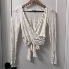 Great Condition Never Worn. First Two Pictures Are Without Flash Second Are With Flash. The Softest Material. Super Light Weight. It Looks Better On The Body Then On The Hanger. Chic White V-neck Wrap Top, Chic White Summer Wrap Top, White Fitted V-neck Wrap Top, Chic White Long Sleeve Wrap Top, Chic White Wrap Top For Spring, Chic White Wrap Top, White V-neck Chic Wrap Top, White Fitted Elegant Wrap Top, Elegant White Fitted Wrap Top