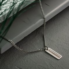 "Discover the essence of personal style with our meticulously crafted 925 sterling silver men's necklace. Designed as a canvas for your individuality, this engravable piece allows you to imprint it with your story, be it a name, a significant date, or a heartfelt message. The allure of this necklace lies not only in its exceptional craftsmanship but also in its minimalist design that seamlessly transitions from everyday wear to special occasions. Its understated elegance exudes sophistication, enhancing your ensemble with a touch of refined masculinity. Choose from the exquisite gold, sleek silver, or bold black finishes to suit your taste and style. Each variation carries its own unique charm, making it an impeccable accessory that embodies your personality. More than just an accessory, t Elegant Bar Necklace With Rectangular Pendant For Personalized Gift, Silver Rectangular Bar Necklace For Personalized Gift, Personalized Silver Bar Necklace With Rectangular Pendant, Custom Name Rectangular Pendant Bar Necklace For Personalized Gift, Personalized Name Rectangular Pendant Bar Necklace, Custom Bar Necklace, Mens Silver Necklace, Custom Bar, Sterling Silver Mens