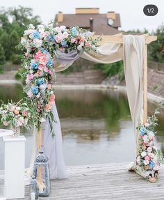 an outdoor wedding setup with flowers and greenery