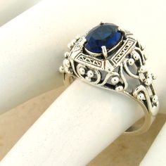 Vintage Estate 1.00 Carat Simulated Sapphire Solitaire Filigree Ring.  925 Solid Sterling Silver. Stamped 925. Excellent Condition/Like New. . Sterling Silver Sapphire Ring With Filigree For Anniversary, Sapphire Ring In Sterling Silver With Intricate Design, Sapphire Filigree Ring In Sterling Silver As A Gift, Sterling Silver Sapphire Filigree Ring Gift, Sapphire Sterling Silver Filigree Gift Ring, Sapphire Sterling Silver Filigree Ring Gift, Classic Sterling Silver Sapphire Ring, Sterling Silver Sapphire Promise Ring With Intricate Design, Oval Hallmarked Sterling Silver Filigree Ring